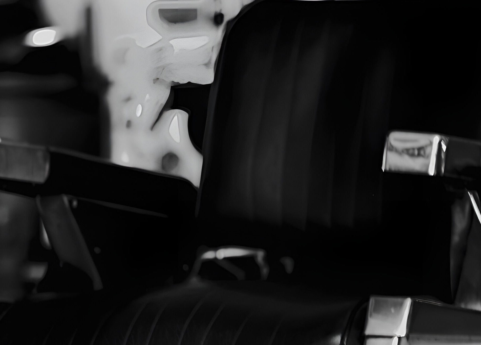 Elegant black barber chair at Cutsmith, Yeadon, England, GB. Sleek design and comfort for a luxury experience.