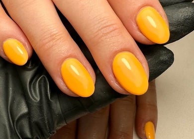 Vibrant yellow manicure at True Nails, Glasgow, Scotland, GB.