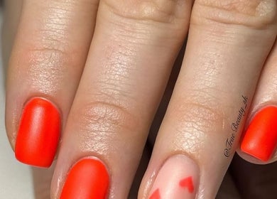 Vibrant red and pink nail art at True Nails in Glasgow, Scotland, GB.
