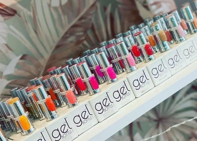 Vibrant gel nail polishes on display at True Nails, Glasgow, Scotland, GB, showcasing a variety of colors.