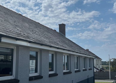 Charming exterior of Laura Leongomez in Neyland, Wales, GB, showcasing its unique slate roof design.