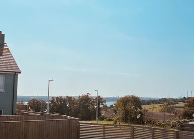 Scenic view from Laura Leongomez venue in Neyland, Wales, GB showcasing coastal horizon.