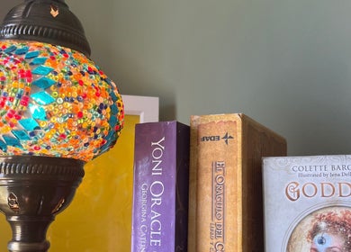 Vibrant mosaic lamp and spiritual books at Laura Leongomez, Neyland, Wales, GB.