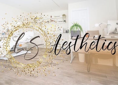 Modern treatment room at LS Aesthetics, Miskin, Wales, GB with sleek furniture and serene ambiance.