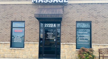 Entrance of Zhenni Spa, Murfreesboro, Tennessee, US, showcasing massage and facial services.