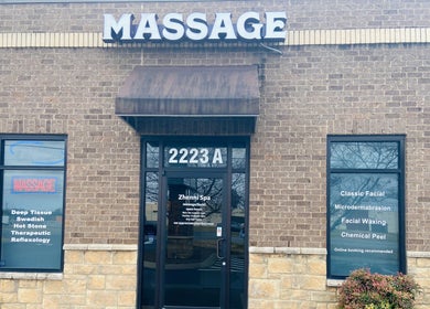 Entrance of Zhenni Spa in Murfreesboro, Tennessee with massage and facial services advertised.