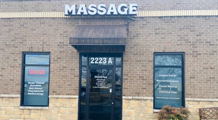 Entrance of Zhenni Spa in Murfreesboro, Tennessee with massage and facial services advertised.