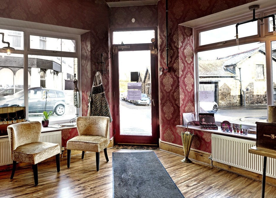 Luxurious interior of Gilded Dreams in Carnforth, England, GB with vintage decor and plush seating.