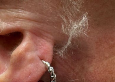 Close-up of an elegant ear piercing at Marie Randall Skin Clinic in Syston, England, GB.
