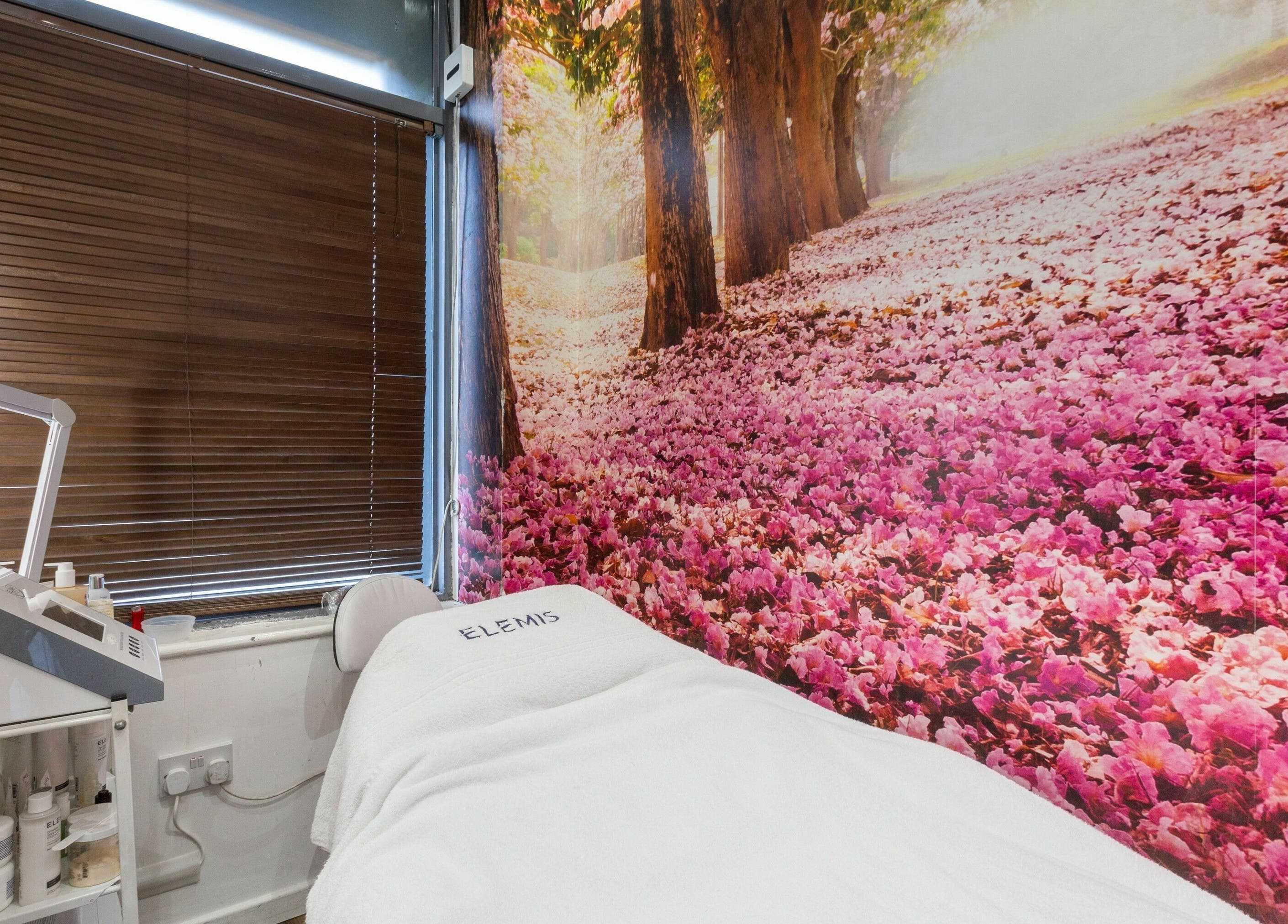 Tranquil treatment room with floral backdrop at The Beauty Inn, London, England, GB.