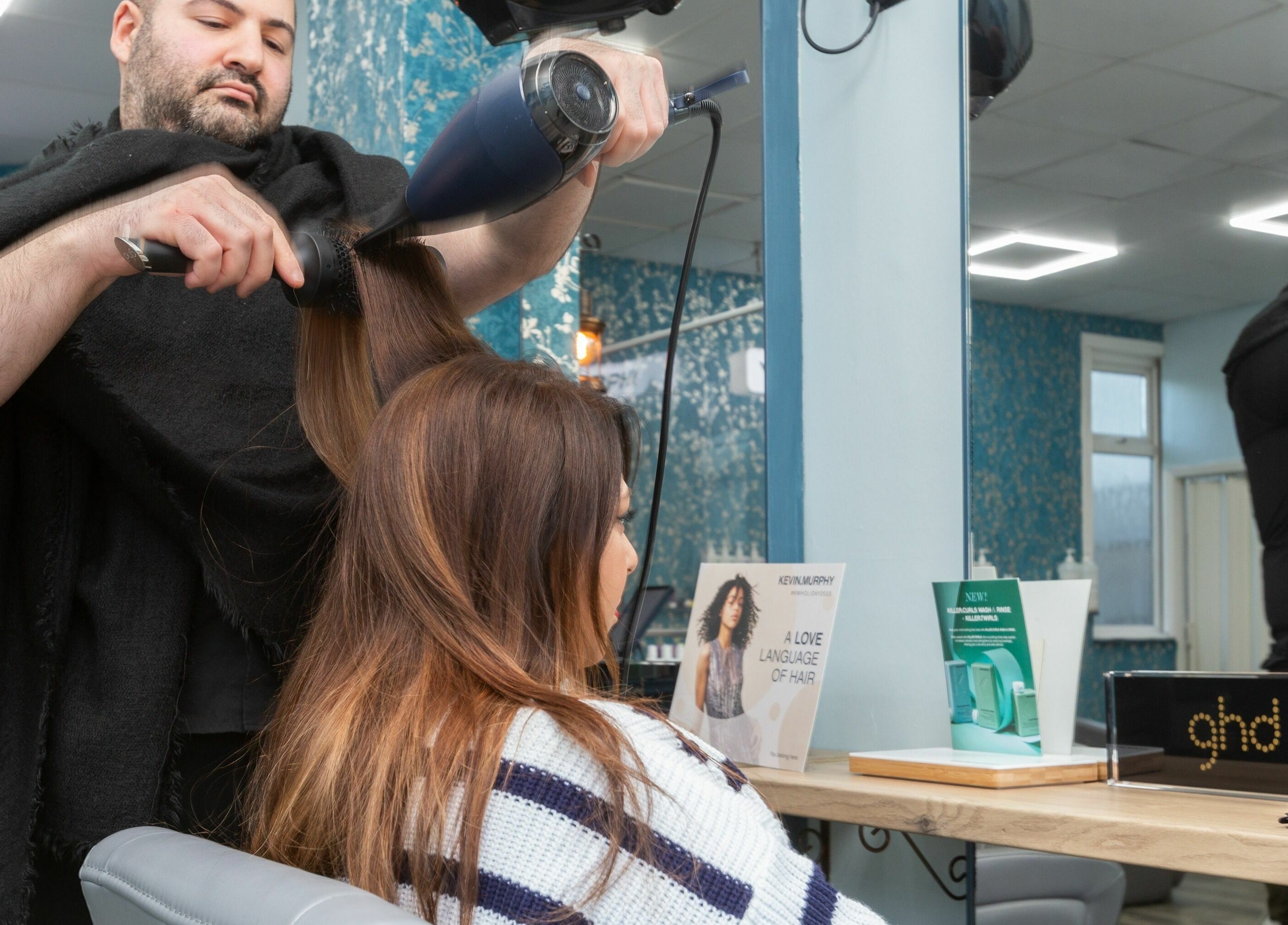Hair styling at The Beauty Inn, London, England, GB. Modern salon ambiance with professional care.