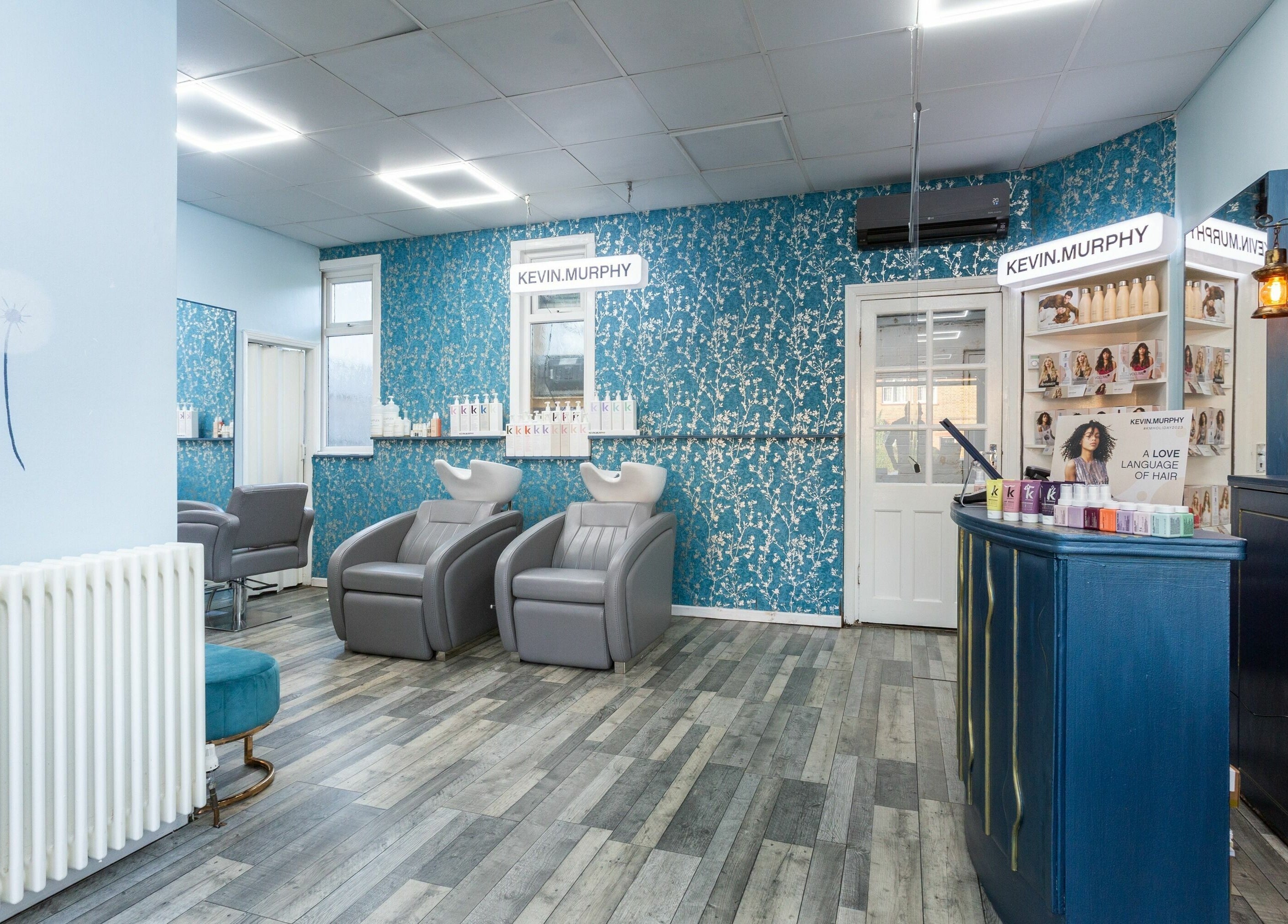 Stylish salon interior at The Beauty Inn, London, England, GB with chic decor and comfortable seating.