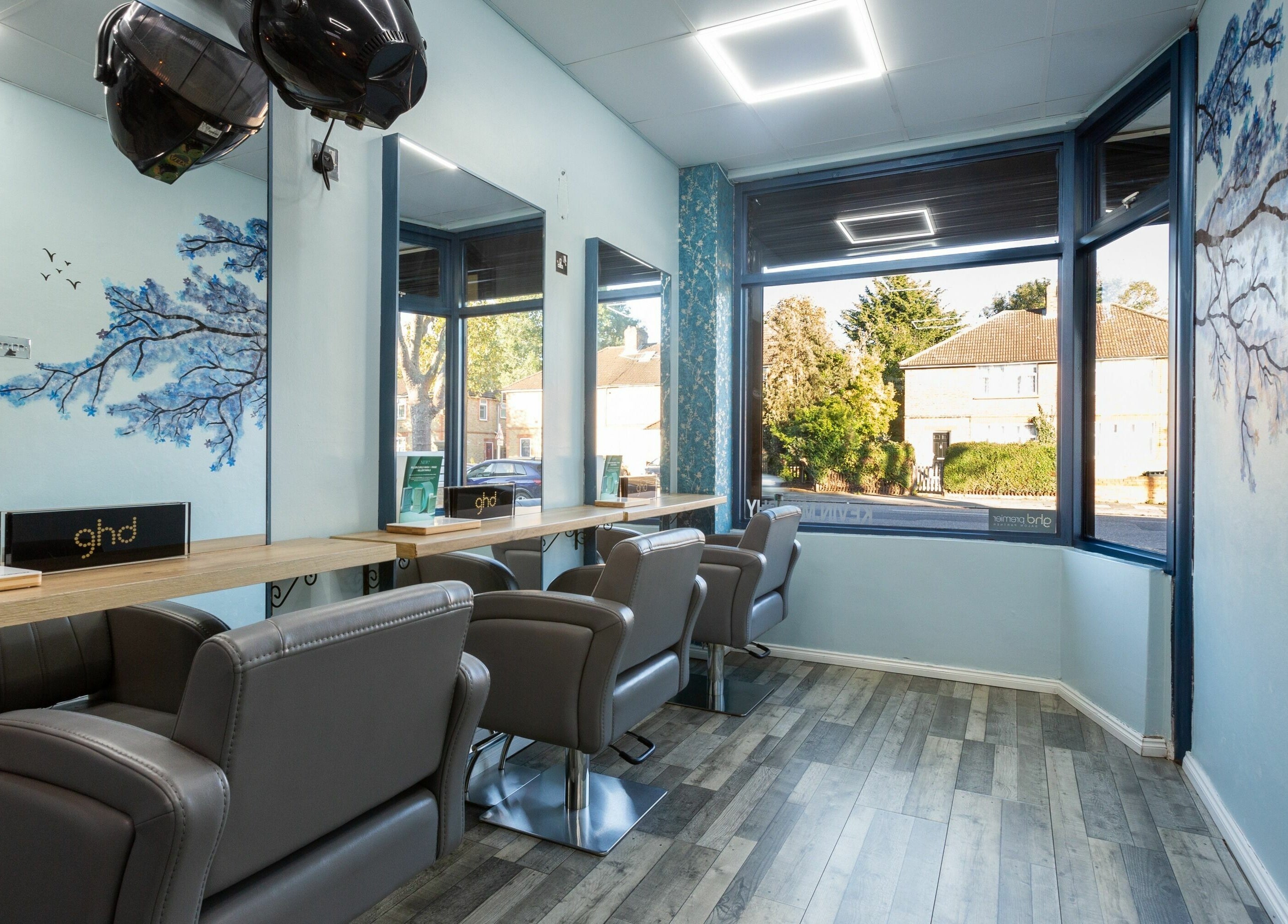 Modern salon interior at The Beauty Inn, London, England GB, featuring stylish chairs and elegant window views.