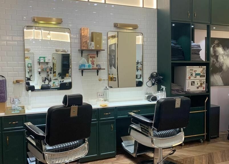 Interior of Canton Barber Sheung Wan on Hong Kong Island featuring classic chairs and modern decor.