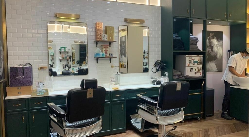 Interior of Canton Barber Sheung Wan on Hong Kong Island featuring classic chairs and modern decor.