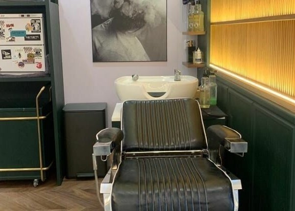 Classic barber chair at Canton Barber Sheung Wan, Hong Kong Island, HK, ready for a stylish grooming session.