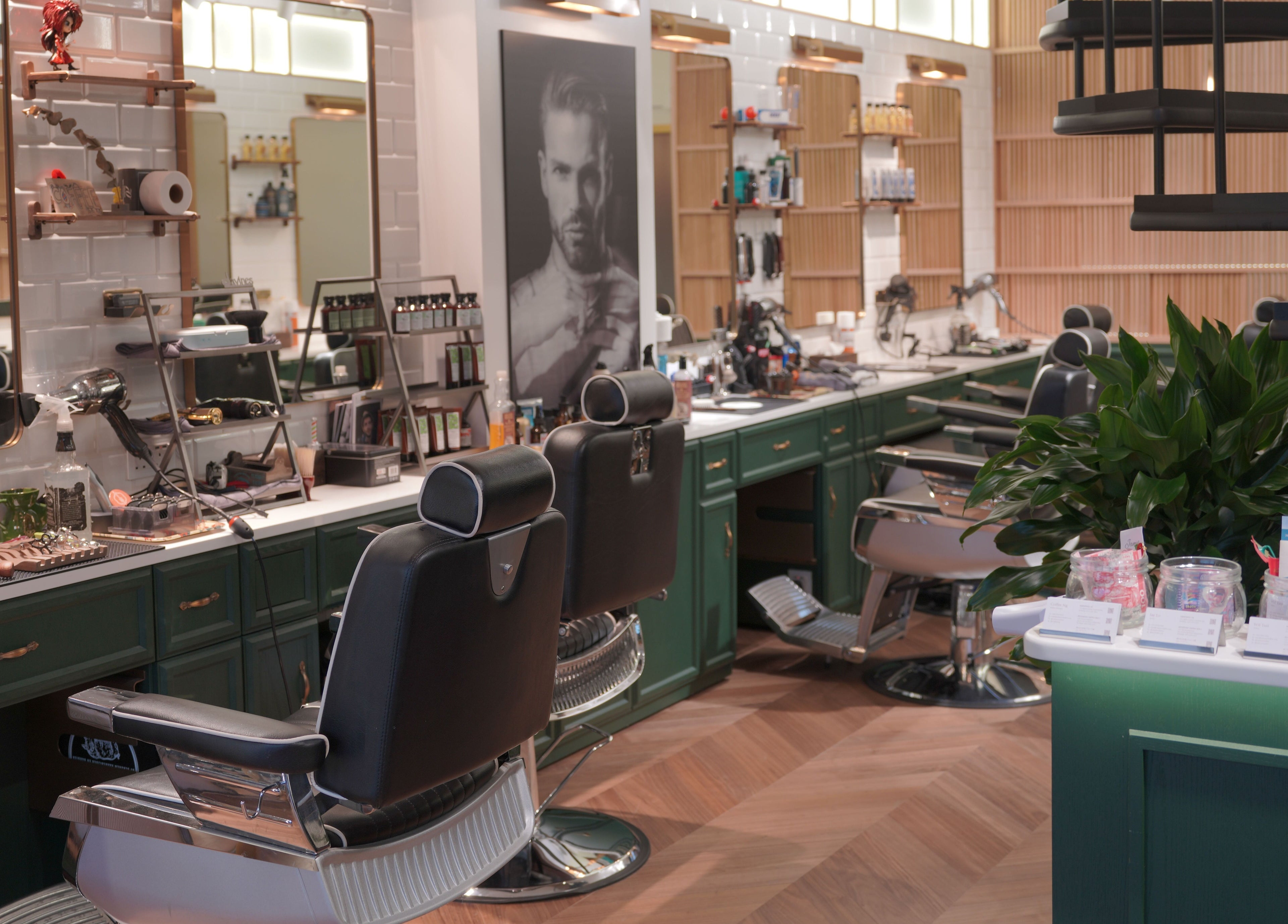 Stylish interior of Canton Barber Wan Chai on Hong Kong Island, HK featuring modern barber chairs and grooming tools.
