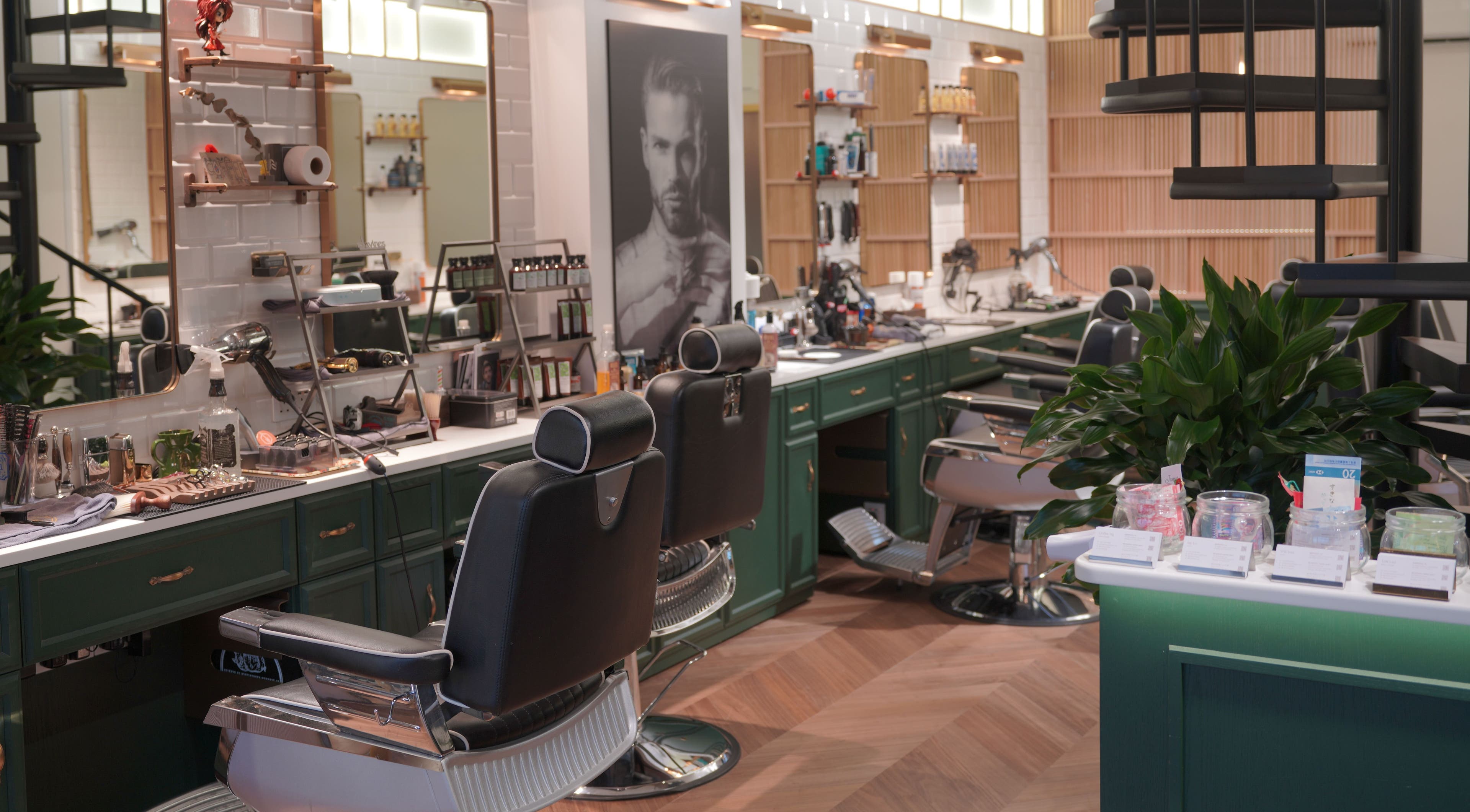 Stylish interior of Canton Barber Wan Chai on Hong Kong Island, HK featuring modern barber chairs and grooming tools.