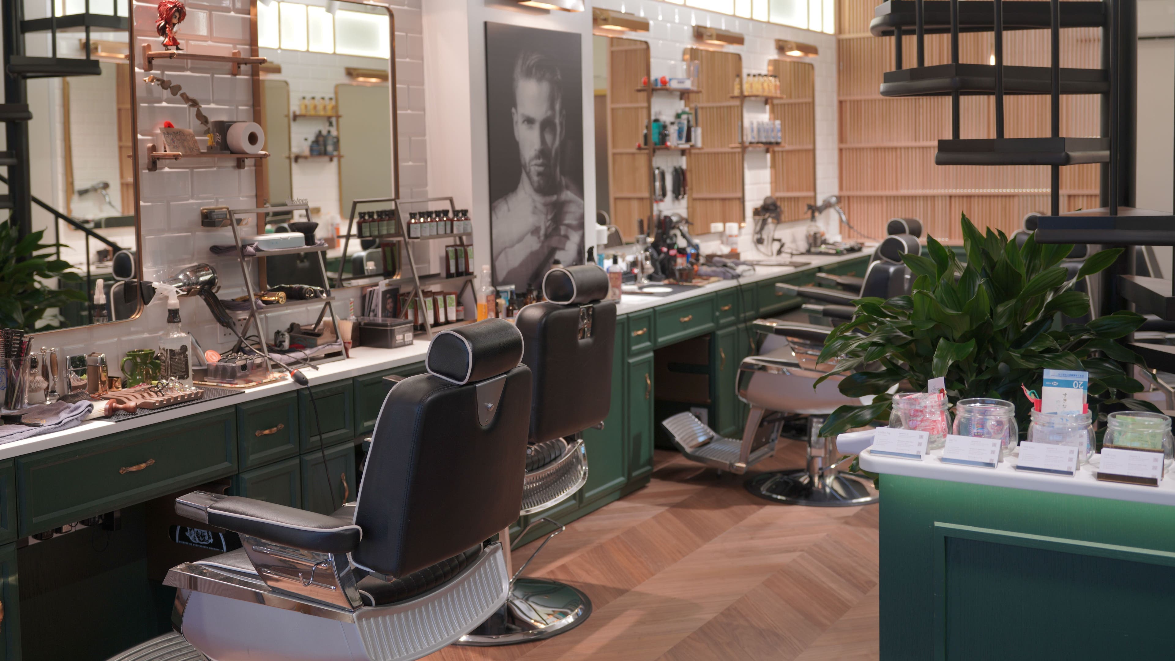 Stylish interior of Canton Barber Wan Chai on Hong Kong Island, HK featuring modern barber chairs and grooming tools.