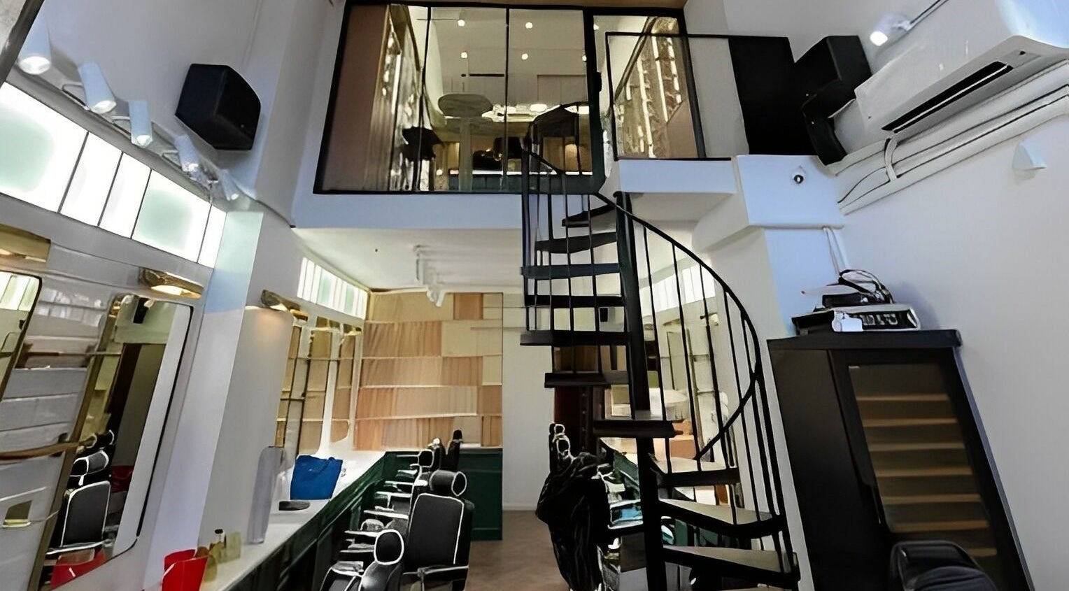 Interior of Canton Barber Wan Chai featuring sleek spiral staircase on Hong Kong Island, Hong Kong Island, HK.