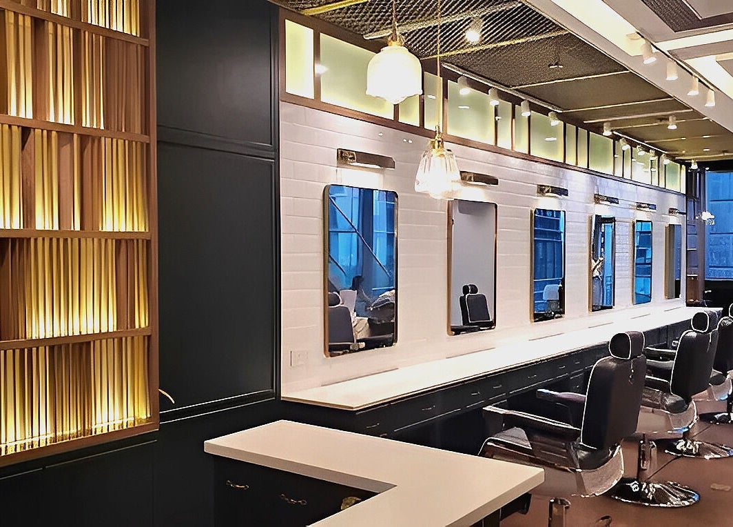 Stylish interior of Canton Barber Causeway Bay on Hong Kong Island, HK, showcasing sleek chairs and modern design.