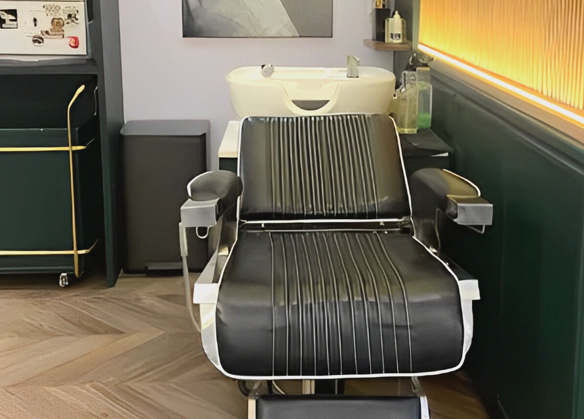 Elegant barber chair at Canton Barber Causeway Bay, a chic venue on Hong Kong Island, HK.