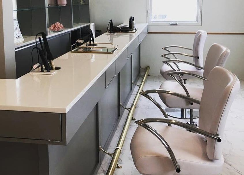 Modern salon chairs at Blowbar, San Juan, San Juan, PR, showcasing sleek design and elegance.