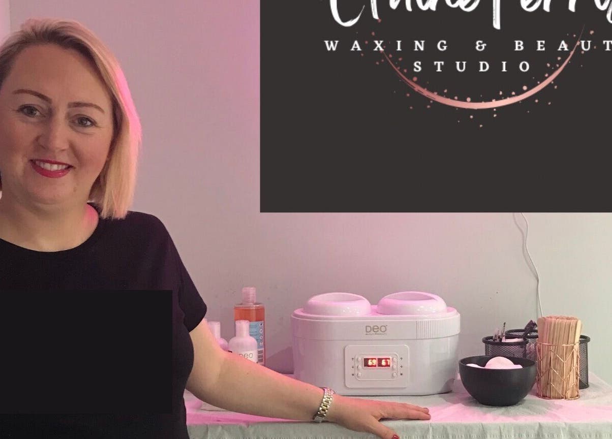 Smiling staff at Elaine Ferris Waxing & Beauty Studio, Bishopbriggs, Scotland, showcasing waxing setup.