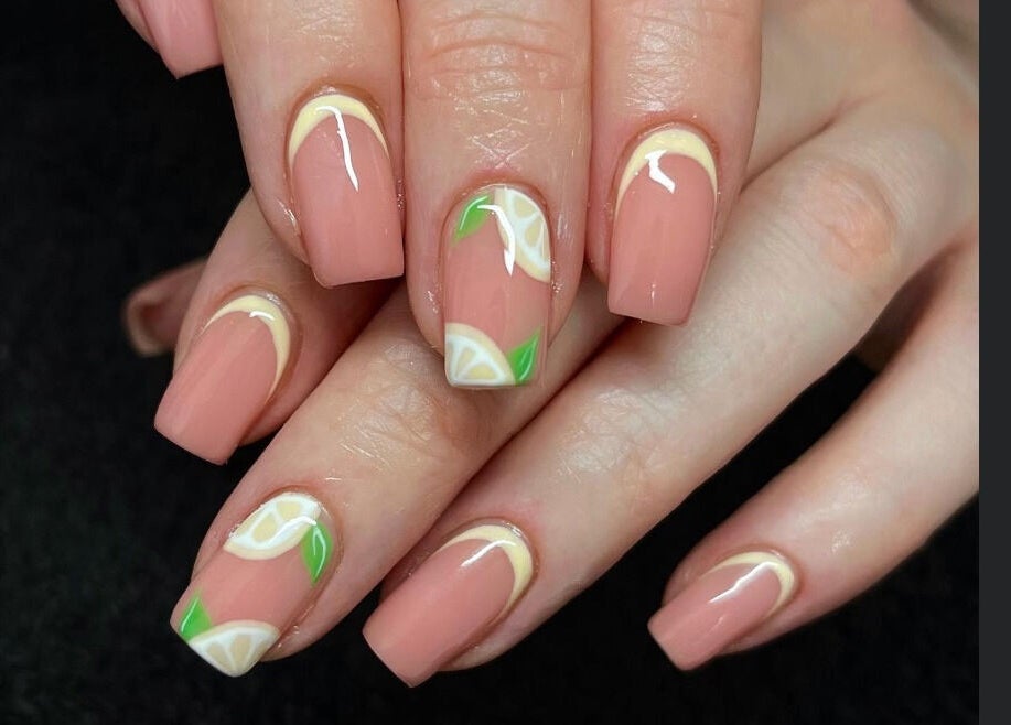 Stylish citrus-themed nail art at Lindsays Nails Birmingham, located in Birmingham, England, GB.