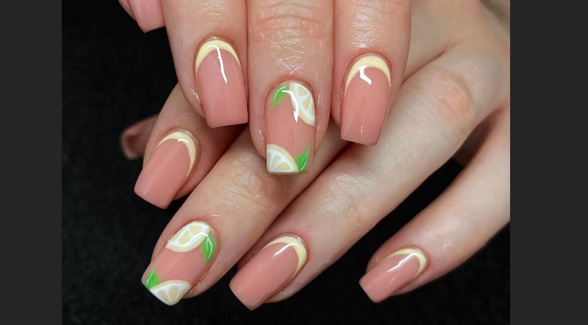 Stylish citrus-themed nail art at Lindsays Nails Birmingham, located in Birmingham, England, GB.