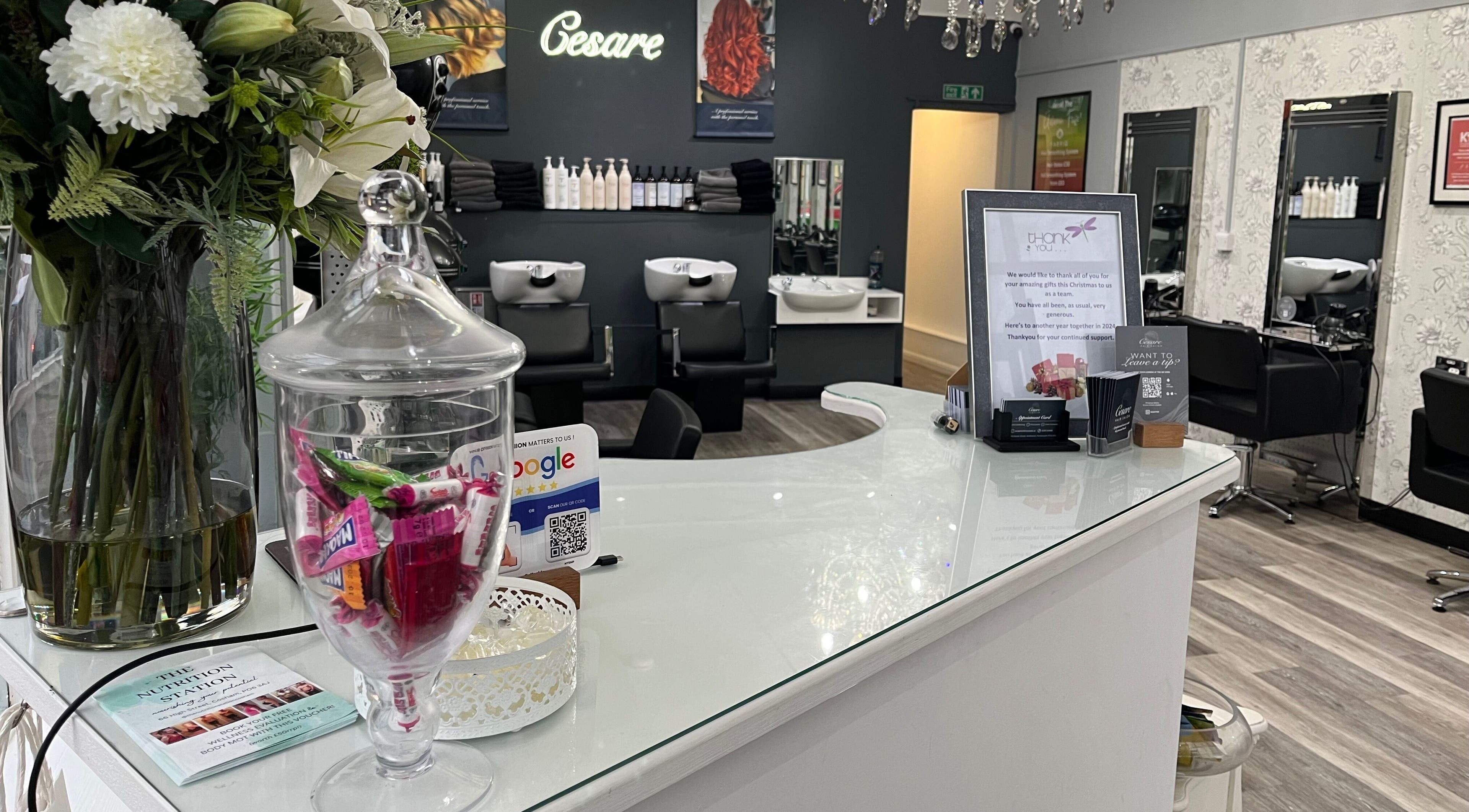 The chic interior of Cesare in Portsmouth, England, GB, featuring a stylish reception with flowers and modern décor.