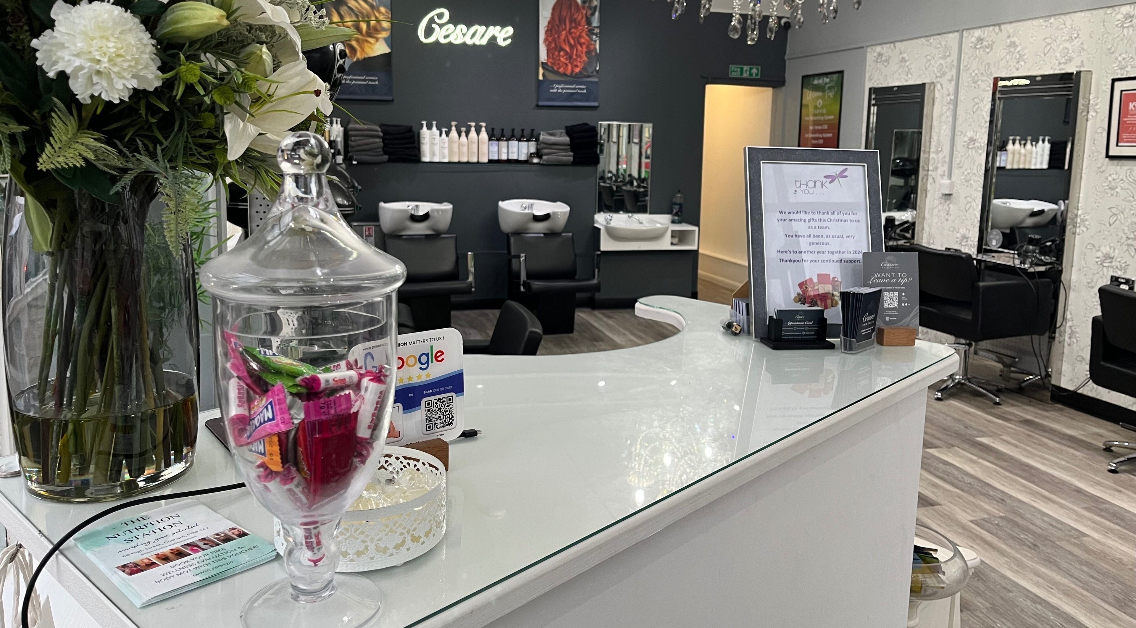 The chic interior of Cesare in Portsmouth, England, GB, featuring a stylish reception with flowers and modern décor.