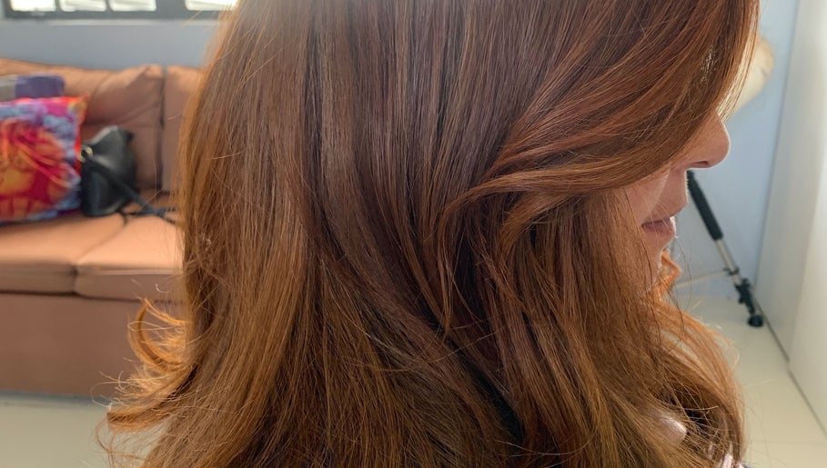 Side profile of styled brown hair at Studio40, Port of Spain, Port of Spain Corporation, TT.