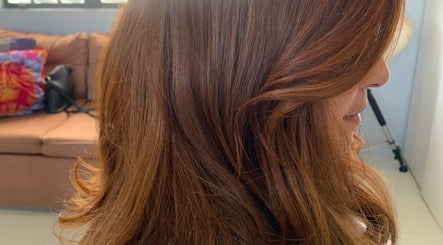 Side profile of styled brown hair at Studio40, Port of Spain, Port of Spain Corporation, TT.