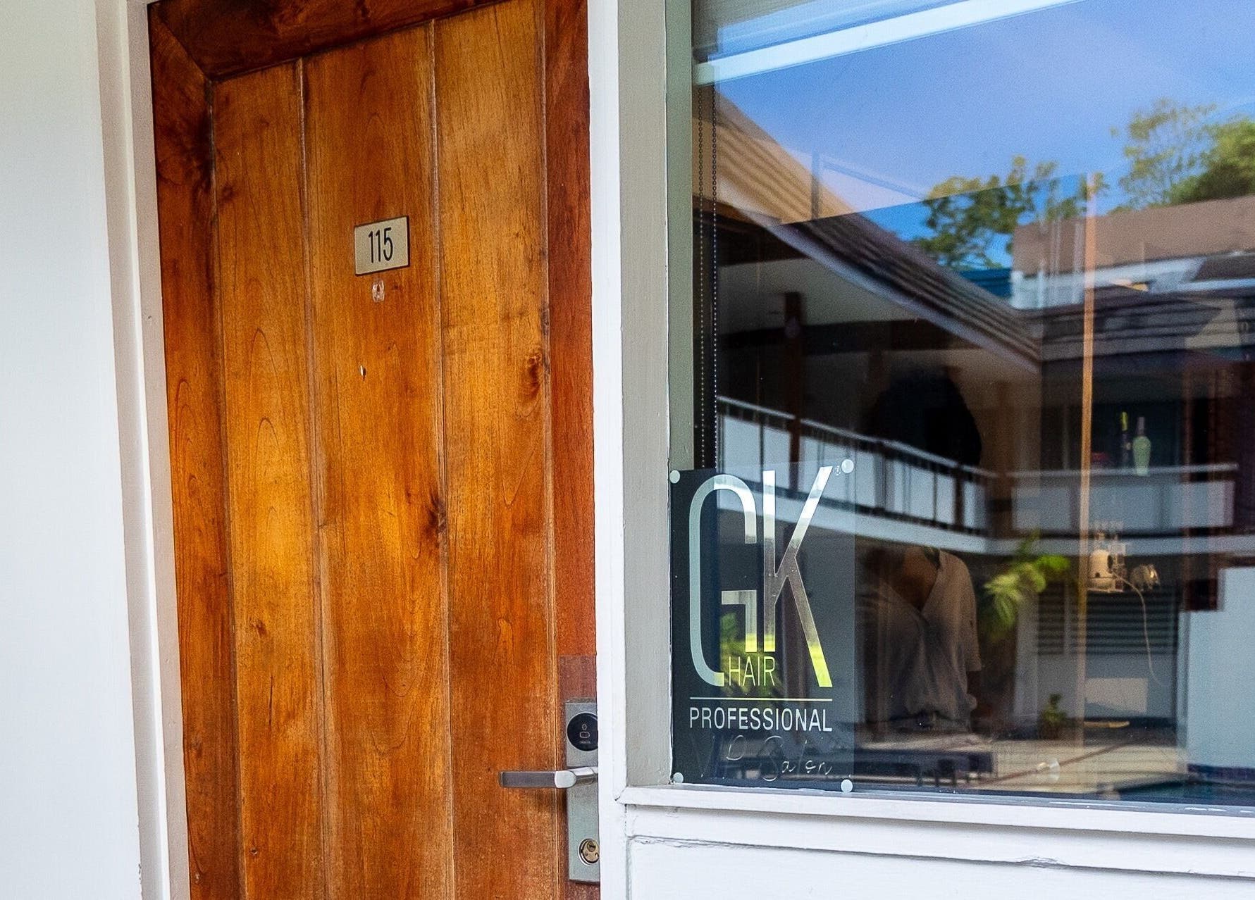 Wooden door entry at Studio40, Port of Spain, Port of Spain Corporation, TT, showcasing peaceful ambiance.