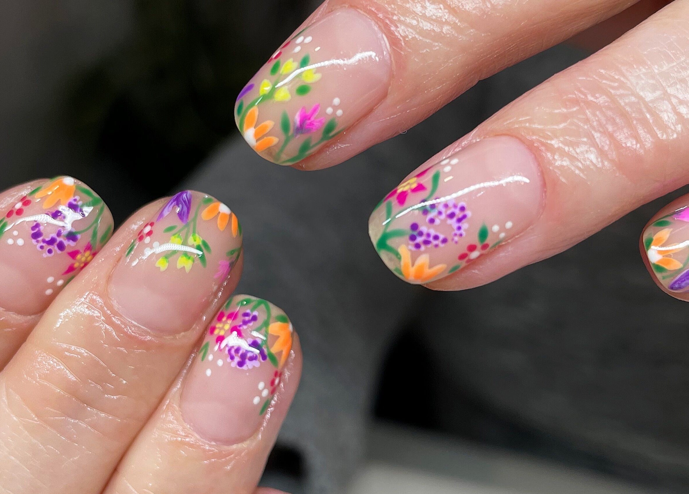 Vibrant floral nail art at Beauty Annex Hemyock, Hemyock, England, GB showcases intricate design.