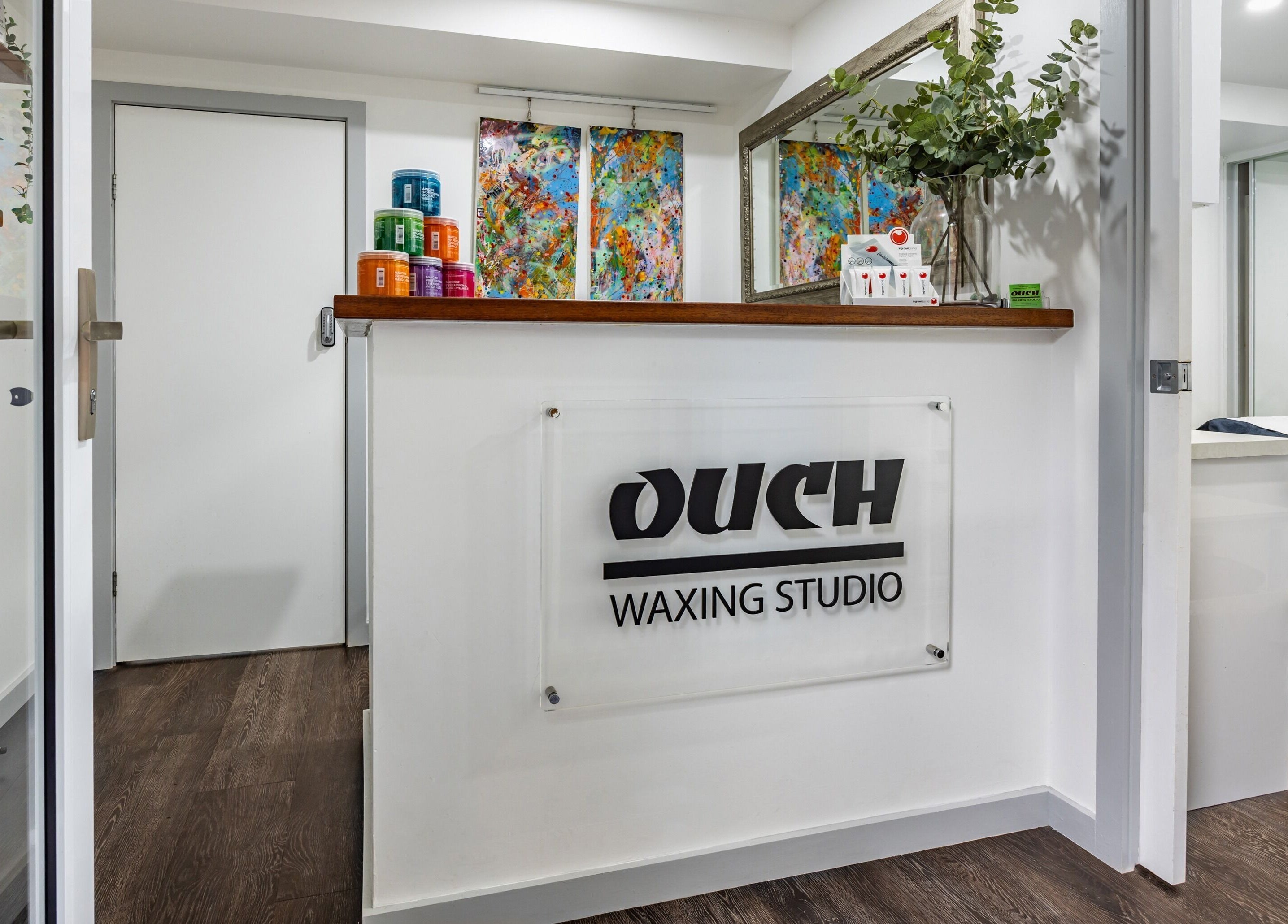 Modern reception at Ouch Waxing Studio, Bonnet Bay, New South Wales, AU with colorful decor.