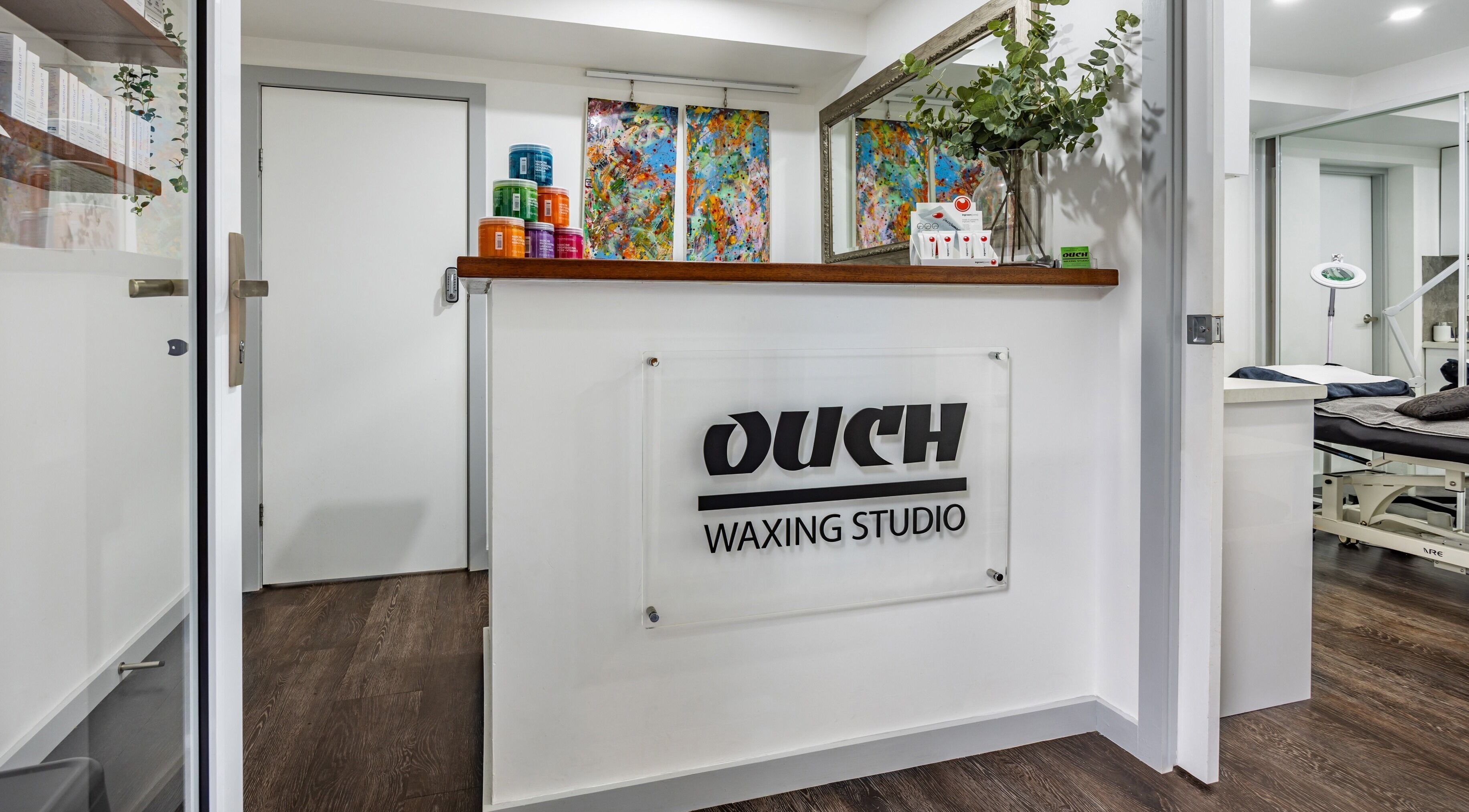 Modern reception at Ouch Waxing Studio, Bonnet Bay, New South Wales, AU with colorful decor.