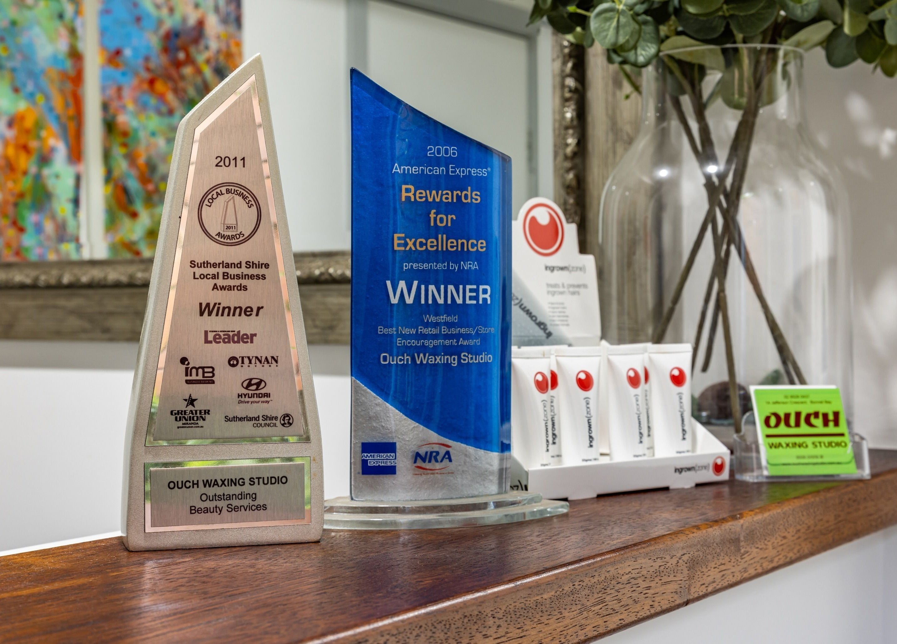 Award-winning display at Ouch Waxing Studio, Bonnet Bay, New South Wales, showcasing local business awards.