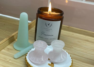 A lit candle and wellness tools at The Skin and Beauty Studio, Beaconsfield, England, GB.