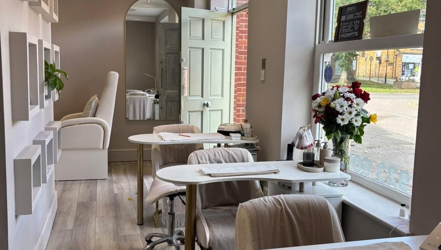 Elegant interior of Beauty By Anna Ashley at Beauty & Co, Abbot’s Langley, GB, featuring chic decor and floral display.