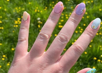 Pastel daisy nail art by Beauty By Anna Ashley at Beauty & Co in Abbot’s Langley, GB. Vibrant and floral design.