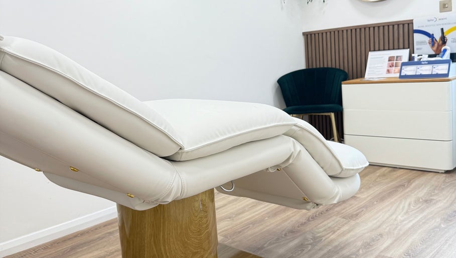 Luxurious treatment chair at The Contour Clinic, Irlam, England, GB, offering a calming wellness ambiance.