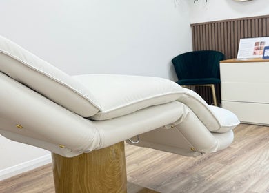 Luxurious treatment chair at The Contour Clinic, Irlam, England, GB, offering a calming wellness ambiance.