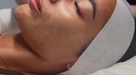 A serene client enjoys a facial treatment at The Contour Clinic, Irlam, England, GB.