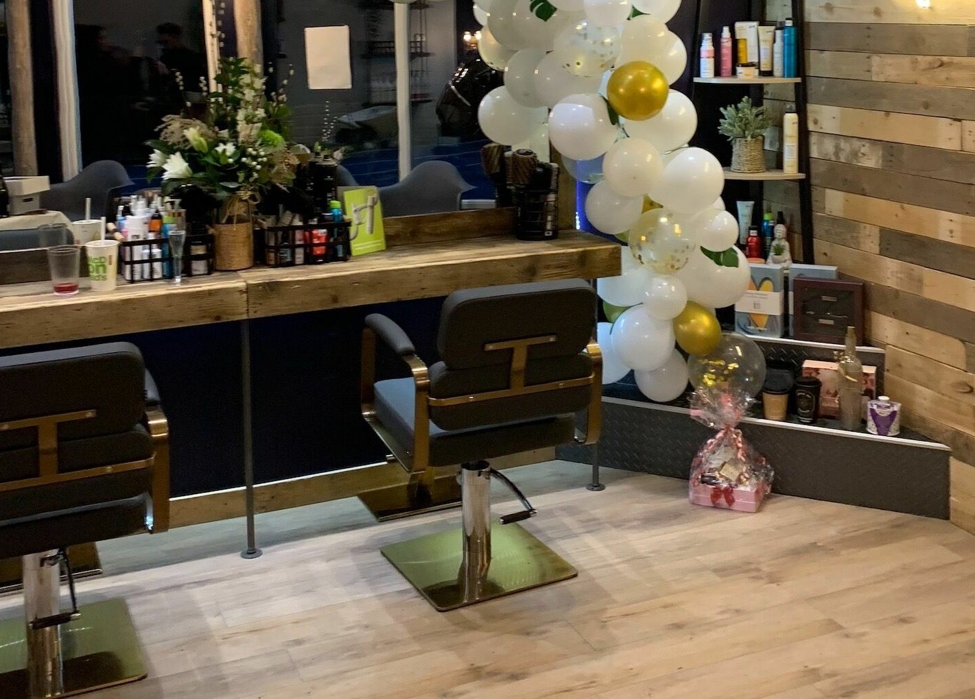 Headhouse salon station with decor and products, Horsforth, England, GB.