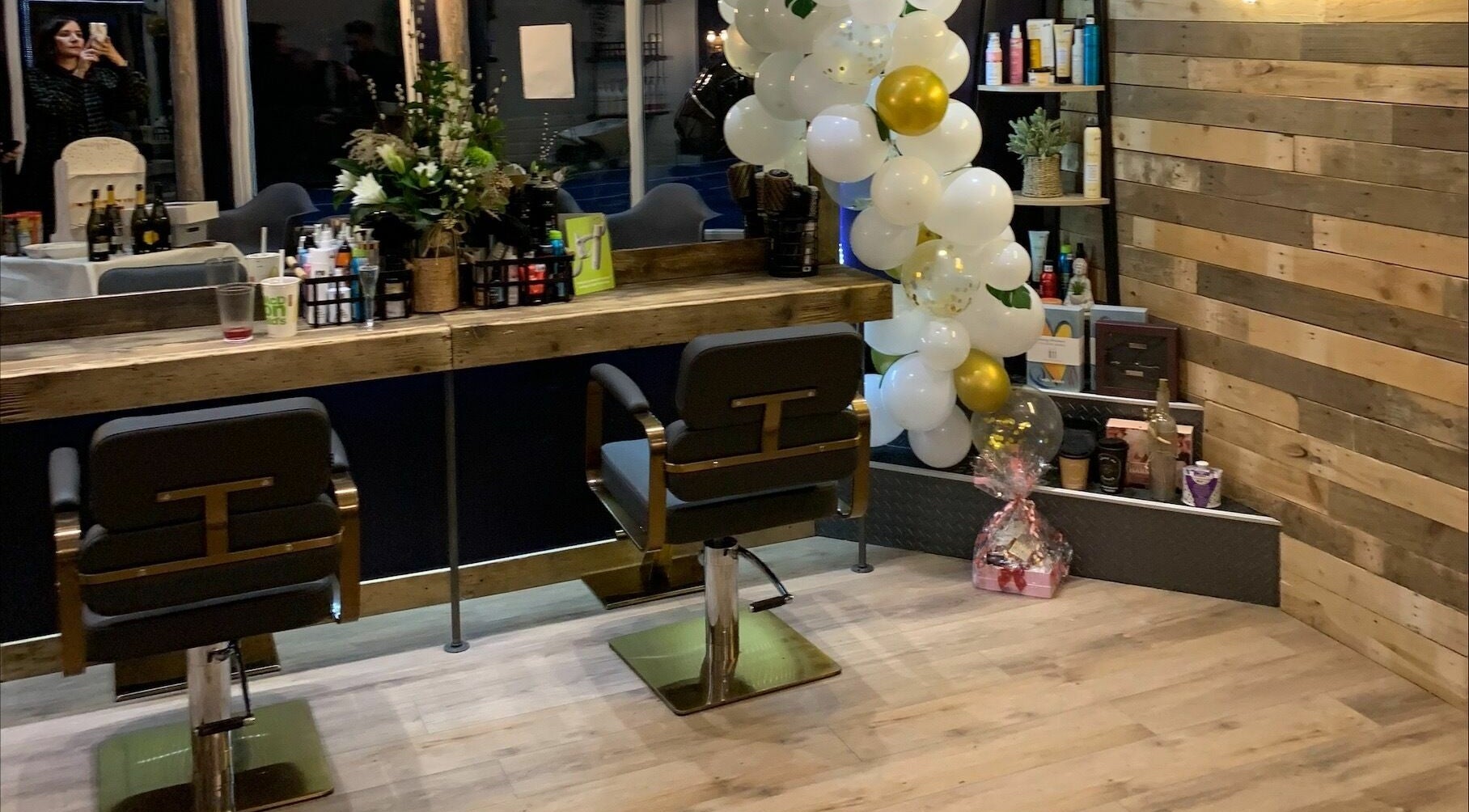 Headhouse salon station with decor and products, Horsforth, England, GB.