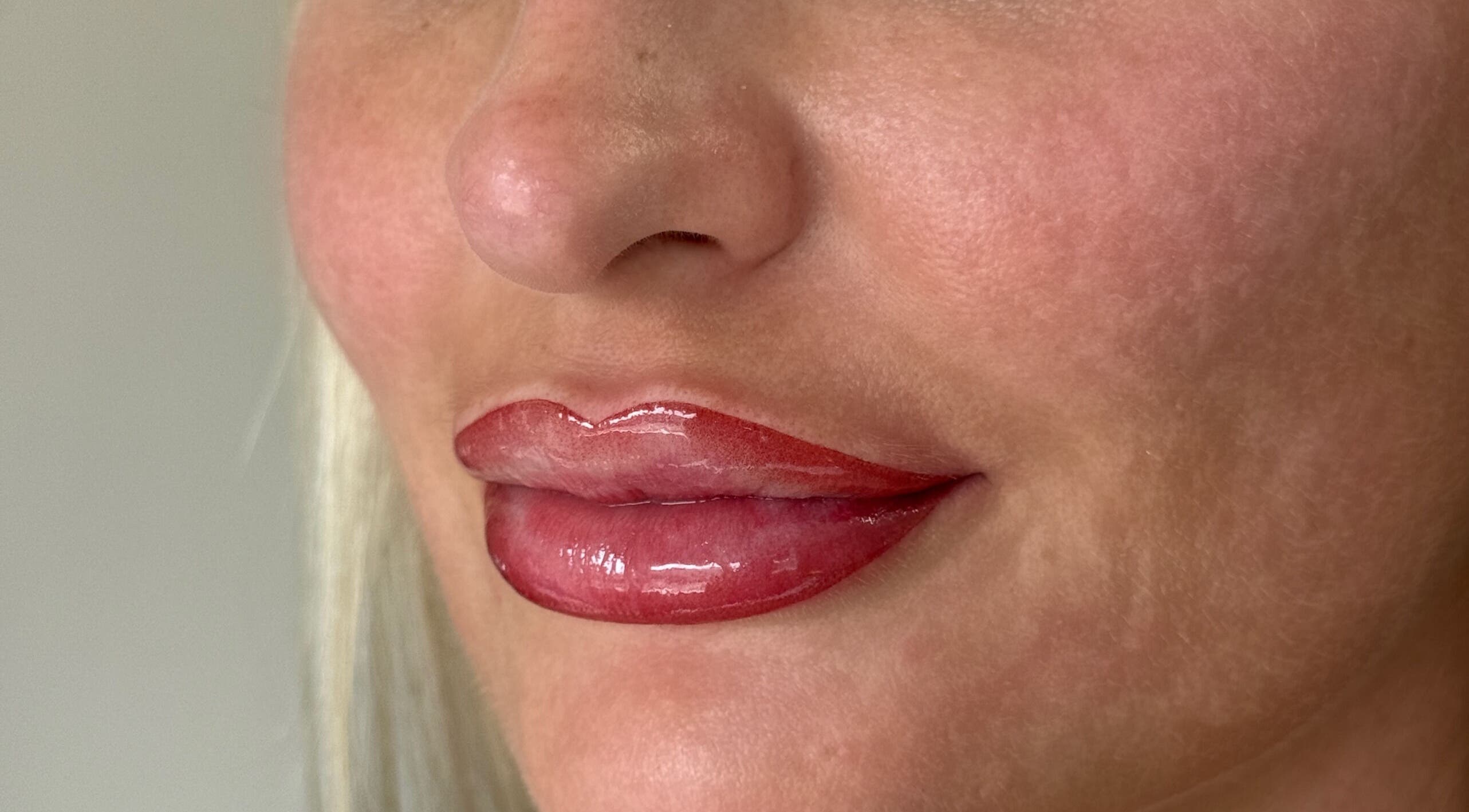 Close-up of expertly done glossy lips at Aestheticá by Phoebe White, Newport, Wales, GB.