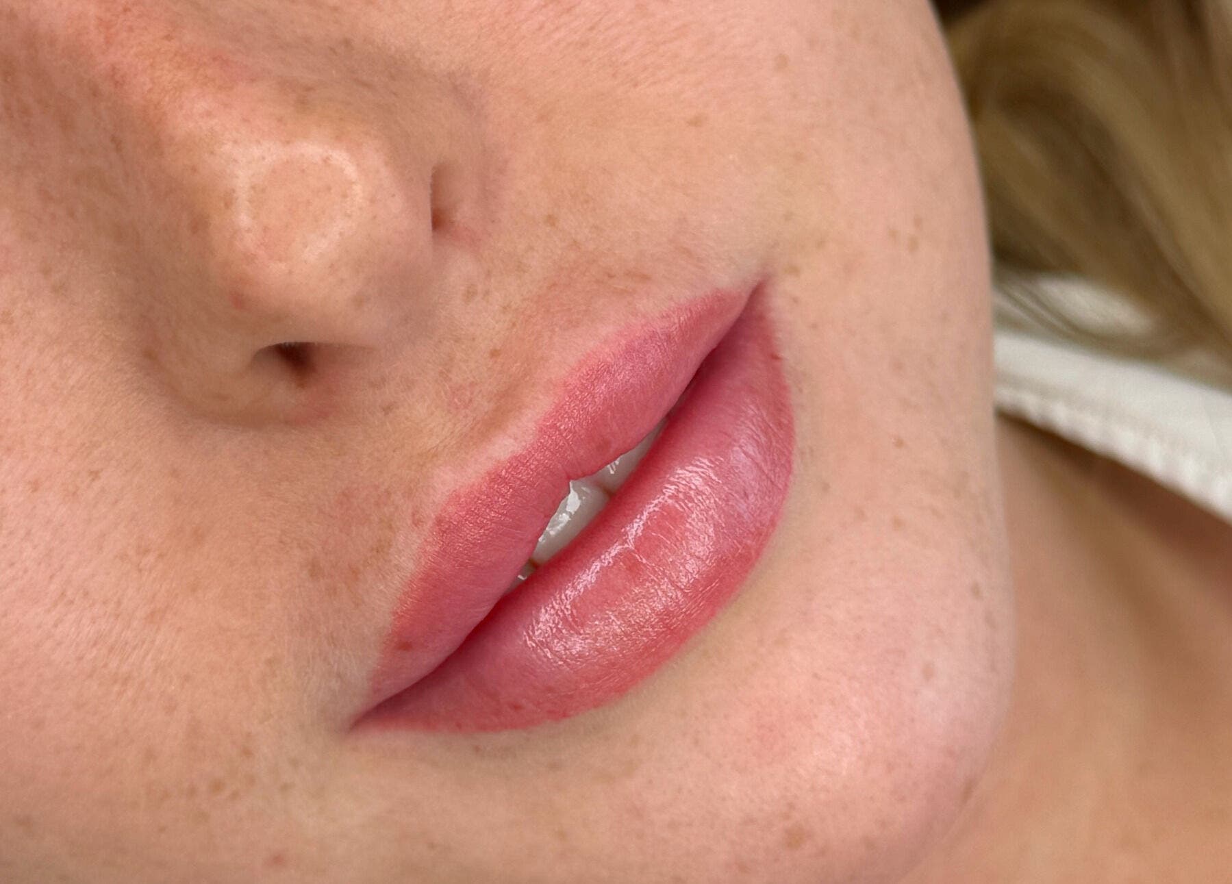 Close-up of glossy lips treated at Aestheticá by Phoebe White, Newport, Wales, GB, showcasing skincare results.