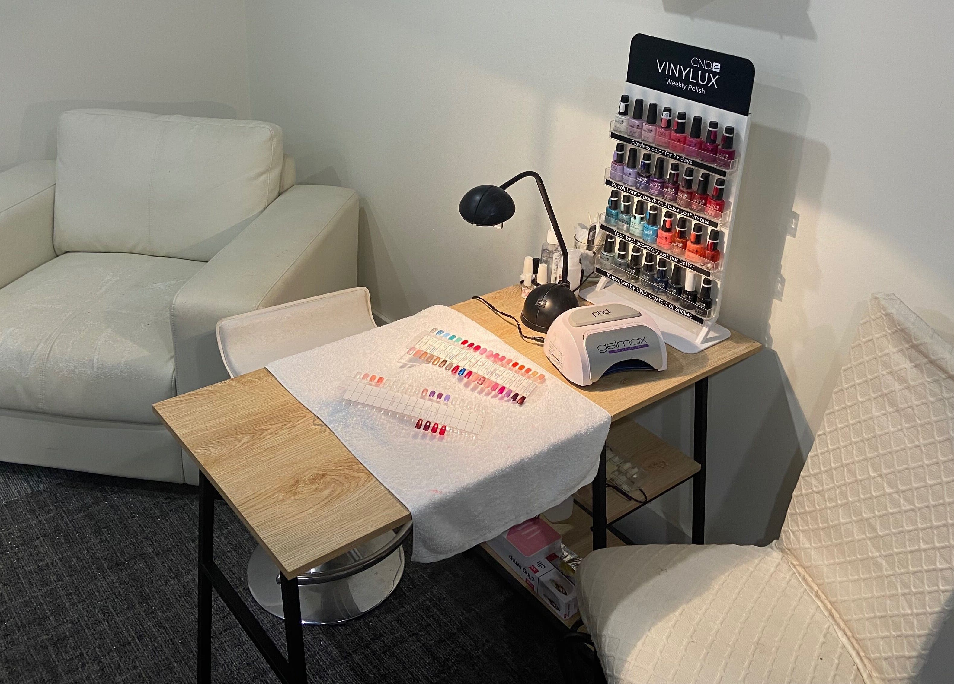 Cozy nail care setup at Sunset Waxing Beauty Studio, Melbourne, Victoria, AU, featuring polish selection.
